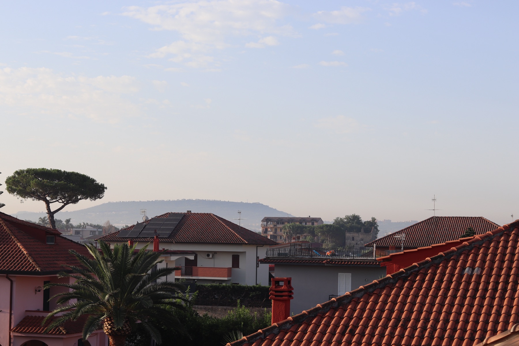 Red rooftops and distant hills near Naples